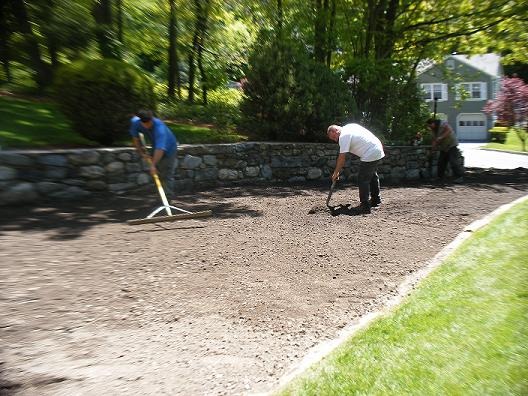 Crew grading a driveway